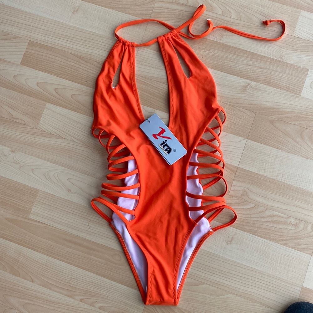 BRAND NEW. NEVER WORN CUT OUT ONE PIECE